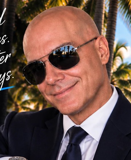 Joe, your Miami Beach driver, in a dark suit and sunglasses